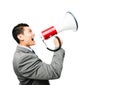 Crazy Asian businessman screaming in megaphone on white background