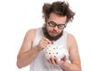 Crazy bearded man with piggy bank Royalty Free Stock Photo