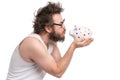 Crazy bearded man with piggy bank Royalty Free Stock Photo