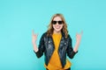 Crazy beautiful rock Girl in leather jacket and black sunglasses. Punk is not dead. Attractive cool young woman.