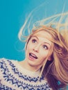 Crazy blonde woman with windblown blonde hair Royalty Free Stock Photo