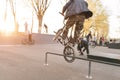 Crazy BMX rider performs tricks in the skate park on the background of the sunset. Jump on the bike Royalty Free Stock Photo