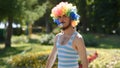 Crazy mime shows hairy armpits and pranks with a whistle in the park. Funny antics in the style of a bodypositive clown on the