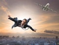 Crazy business man flying from passenger plane with glad and hap Royalty Free Stock Photo