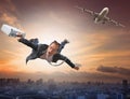 Crazy business man flying from passenger plane with glad and hap Royalty Free Stock Photo