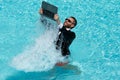 Crazy business man relaxing in suit on swimming pool. Summer vacation, business on sea beach. Summer rest, business Royalty Free Stock Photo