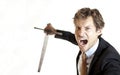 Crazy businessman attacking with sword Royalty Free Stock Photo