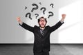 Crazy businessman with drawing question marks over head Royalty Free Stock Photo