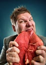 Crazy businessman with meat