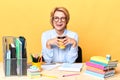 Crazy businesswoman holding disposable lastic cup showing tongue