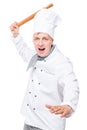 crazy chef attacking a wooden rolling pin on a white Royalty Free Stock Photo