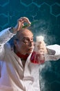 Crazy chemist scientist focused on experiment Royalty Free Stock Photo