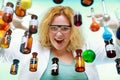 Crazy chemist woman with chemical glassware flask Royalty Free Stock Photo