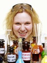 Crazy chemist woman with chemical glassware flask isolated Royalty Free Stock Photo