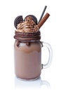 Crazy chocolate milk shake with whipped cream, cookies and black straw in glass jar Royalty Free Stock Photo