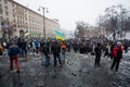 Crazy crowd of protesters walking in the burned square after fight with police in capital during anti-government riot in Kiev