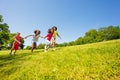 Crazy cute happy kids run in park holding hands Royalty Free Stock Photo