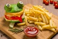 Crazy frog burger on a wooden board Royalty Free Stock Photo