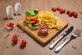 Crazy frog burger on a wooden board Royalty Free Stock Photo