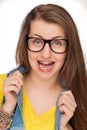 Crazy girl with braces wearing geek glasses Royalty Free Stock Photo