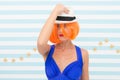 Crazy girl in hat. fashion woman with orange hair. Glamour fashion model. Stylish girl with crazy look. Beauty and
