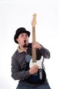 Crazy Guitarist in Tophat Making Funny Face Royalty Free Stock Photo
