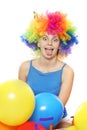 Crazy happy woman with colored hair over white