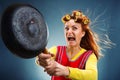 Crazy housewife with pan Royalty Free Stock Photo