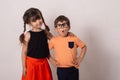 Crazy kids! Bright kids. Happy boy and girl isolated on grey. Fun children background.