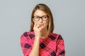 Crazy looking sly woman in glasses isolated Royalty Free Stock Photo