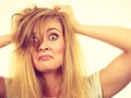 Crazy, mad blonde woman with messy hair Royalty Free Stock Photo