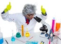 Crazy mad nerd scientist at laboratory microscope Royalty Free Stock Photo