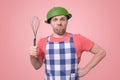 Crazy man in an apron with a colander on his head Royalty Free Stock Photo