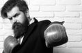 Crazy man boxing. Hard business. Businessman wearing suit standing in red boxing gloves, conflict and fight concept Royalty Free Stock Photo