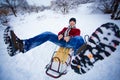 Crazy man enjoy a sleigh ride. Man sledding Royalty Free Stock Photo