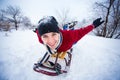 Crazy man enjoy a sleigh ride. Man sledding Royalty Free Stock Photo