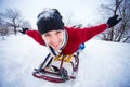 Crazy man enjoy a sleigh ride. Man sledding Royalty Free Stock Photo