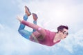 Crazy man in goggles is flying in in the cloudy sky. Jumper concept Royalty Free Stock Photo