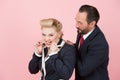 Crazy managers in suits and perls. Blonde and boss in red tie have fun in studio with perls Royalty Free Stock Photo