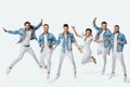 crazy men and woman in denim t-shirt jeans jumping high Royalty Free Stock Photo