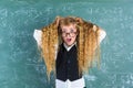 Crazy nerd blond student girl hold hair surprised