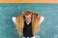 Crazy nerd blond student girl hold hair surprised