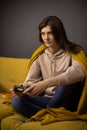 Crazy obsessed with games lady plays video game holding console gamepad in hands