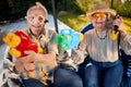 Crazy old people have fun on vacation playing with  water gun Royalty Free Stock Photo