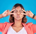 Crazy, peace sign and a woman with a pout on a blue background for comic aesthetic. Funny, fashion and a young girl or