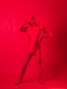 Crazy red man on a red background. figure in a leotard.