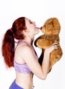 Crazy redhead young woman licks a bears nose
