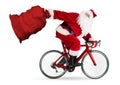 Crazy santa claus rushing fast in a hurry late on road racer racing carbon bicycle with big huge jute bag isolated Royalty Free Stock Photo