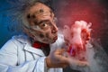 Crazy scientist smelling explosive experiment Royalty Free Stock Photo