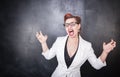 Crazy screaming teacher on chalkboard background Royalty Free Stock Photo